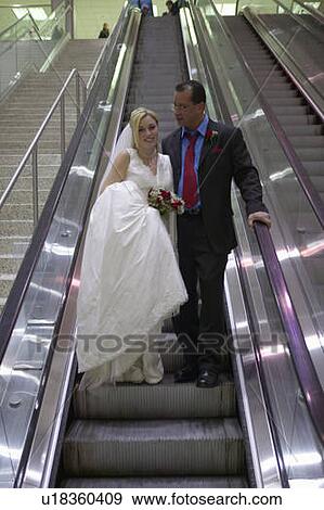 Stock Photo - Groom and Bride in airport. Fotosearch