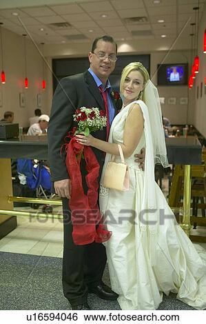 Stock Photograph - Groom and Bride in airport. Fotosearch