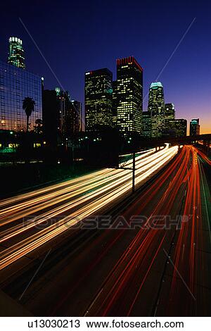 Stock Image - Harbor Freeway with the streaked lights from rush hour traffic at sunset. Fotosearch