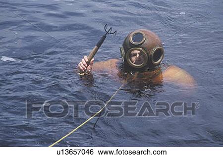 Historic Greek sponge diver in antique diving suit dives View Large Photo Image Stock Photograph - Historic Greek sponge diver in antique diving suit dives. Fotosearch