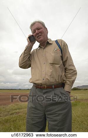 John Taft making a phone call on Satellite phone View Large Photo Image Stock Image - John Taft making a phone call on Satellite phone. Fotosearch