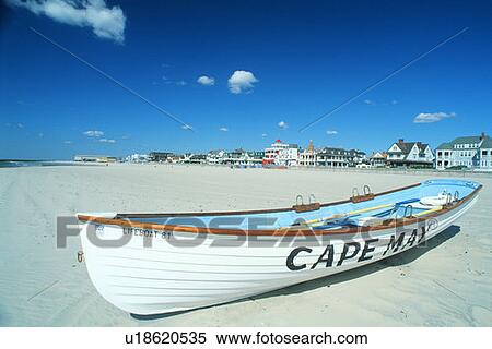 Life boat on a beach in Cape May, New Jersey View Large Photo Image Stock Photography - Life boat on a beach in Cape May, New Jersey. Fotosearch