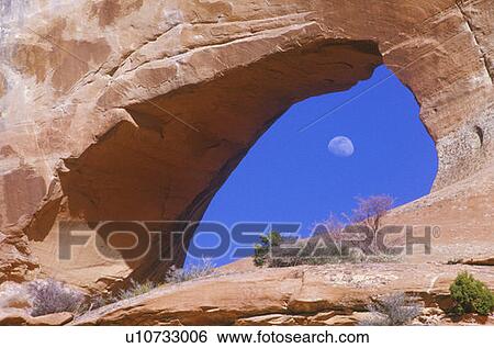 Moon Seen Through Rock Formation, Utah View Large Photo Image Stock Photograph - Moon Seen Through Rock Formation, Utah. Fotosearch