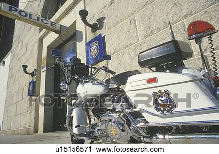 Stock Image - Motorcycle parked at police station. Fotosearch