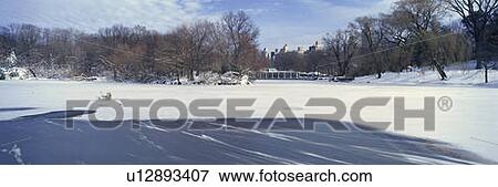Stock Photo - Panoramic view of frozen pond in Central Park. Fotosearch
