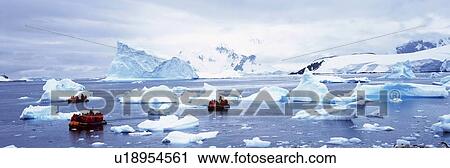 Panoramic view of tourists in inflatable boat with glaciers View Large Photo Image Stock Image - Panoramic view of tourists in inflatable boat with glaciers. Fotosearch