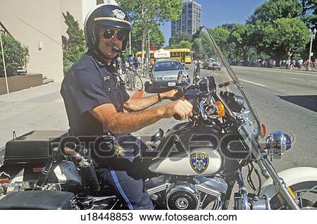 Policeman poses on his motorcycle View Large Photo Image Stock Image - Policeman poses on his motorcycle. Fotosearch