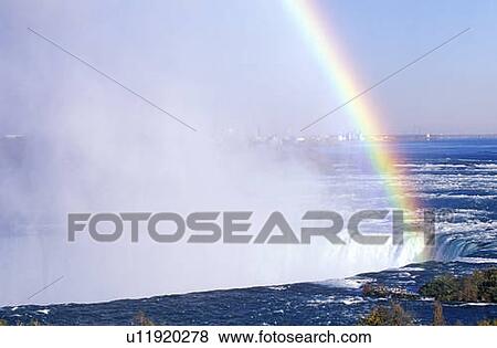 Stock Photo - Rainbow Over Niagara Falls, Canada. Fotosearch