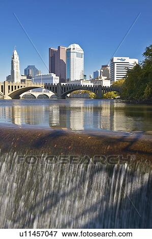 Scioto River with waterfall and Columbus Ohio skyline, with setting sunlight View Large Photo Image Stock Photo - Scioto River with waterfall and Columbus Ohio skyline, with setting sunlight. Fotosearch