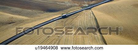 Semi-Truck driving through Wheat Fields View Large Photo Image Stock Photo - Semi-Truck driving through Wheat Fields. Fotosearch