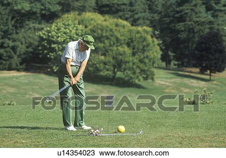 Stock Image - Senior golfer on course, Columbia Country Club, Bethesda, Maryland. Fotosearch