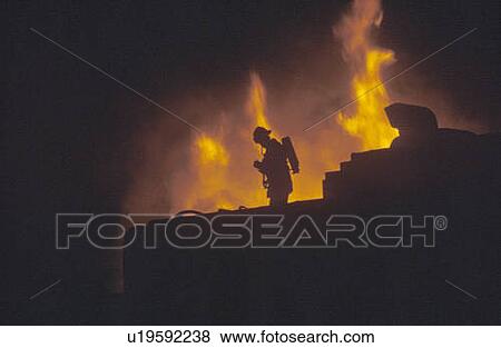 Silhouette of fireman in front of blaze View Large Photo Image Stock Photo - Silhouette of fireman in front of blaze. Fotosearch
