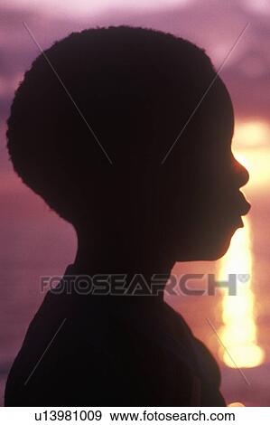 Silhouette of young Jamaican at sunset View Large Photo Image Stock Photo - Silhouette of young Jamaican at sunset. Fotosearch