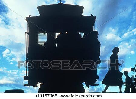 Silhouetted passenger getting off a cable car in San Francisco, California View Large Photo Image Stock Photography - Silhouetted passenger getting off a cable car in San Francisco, California. Fotosearch