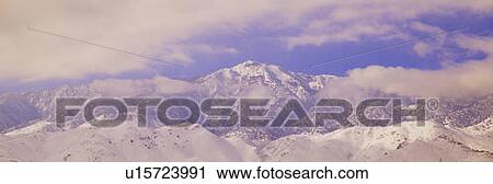 Snowy mountains and clouds in Sierra Nevada Mountains, California View Large Photo Image Stock Image - Snowy mountains and clouds in Sierra Nevada Mountains, California. Fotosearch
