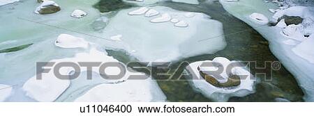 Stock Image - Snowy river in New Hampshire. Fotosearch
