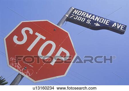 Picture - Stop sign at Normandie Avenue, South Central Los Angeles, California. Fotosearch