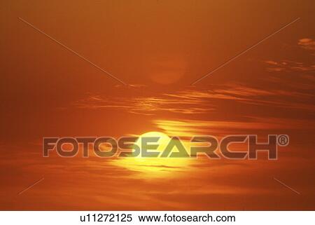 Sun Setting Through Clouds View Large Photo Image Stock Photography - Sun Setting Through Clouds. Fotosearch