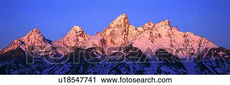 Stock Image - Sunrise on Grand Tetons, Grand Teton National Park, Wyoming. Fotosearch