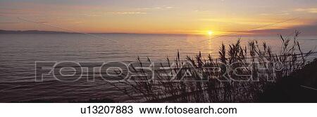 Stock Image - Sunset over Pacific Ocean near Santa Barbara, California. Fotosearch