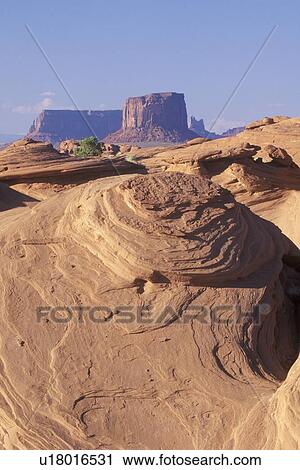 Stock Image - Swirling Sandstone Rock Formation, Monument Valley, Arizona. Fotosearch