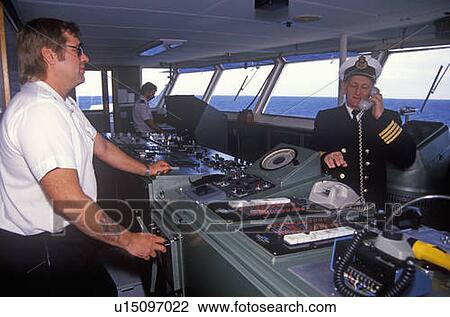 Stock Image - The captain of the ferry Bluenose speaking on the phone. Fotosearch