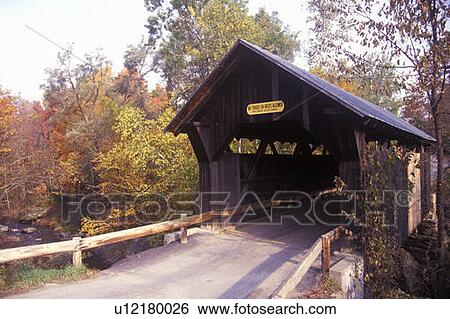 Stock Photograph - The Goldbrook Covered Bridge in Stowe, Vermont during the winter. Fotosearch