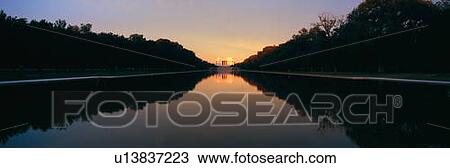 Stock Image - The Lincoln Memorial at Sunset with mirror image from reflecting pool in Washington D. C.. Fotosearch