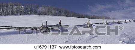 This is a wooden fence nearly buried in snow near Emerald Bay in winter. View Large Photo Image Stock Photo - This is a wooden fence nearly buried in snow near Emerald Bay in winter.. Fotosearch