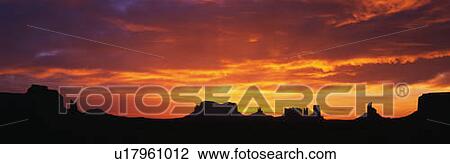 This is sunrise on Monument Valley. The rocks are in silhouette against an orange sky. View Large Photo Image Stock Image - This is sunrise on Monument Valley. The rocks are in silhouette against an orange sky.. Fotosearch