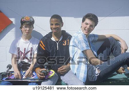 Three teenage boys posing for a picture View Large Photo Image Stock Image - Three teenage boys posing for a picture. Fotosearch