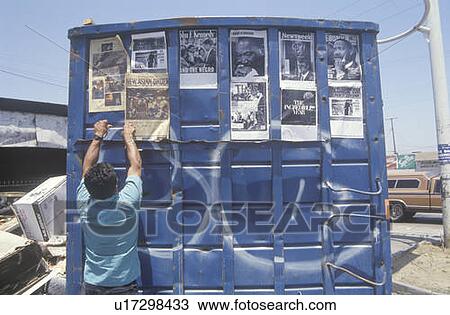 Trash dumpster used as community bulletin board View Large Photo Image Stock Image - Trash dumpster used as community bulletin board. Fotosearch
