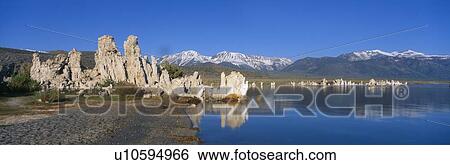 Stock Photograph - Tufa rock formations emerging from Mono Lake, California. Fotosearch