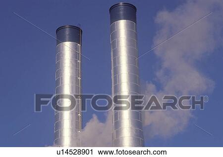 Two smokestacks in industrial America View Large Photo Image Stock Image - Two smokestacks in industrial America . Fotosearch