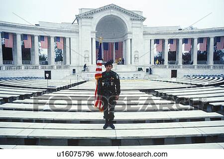 Stock Photograph - Veteran Holding Flag, Arlington National Cemetery, Washington, D. C.. Fotosearch