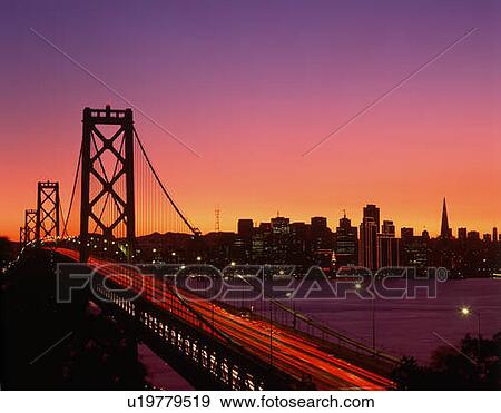 View of Bay Bridge from Treasure Island at sunset, San Francisco, California View Large Photo Image Stock Photo - View of Bay Bridge from Treasure Island at sunset, San Francisco, California. Fotosearch