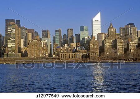 Stock Photo - View of midtown New York from Queens and the East River, NY. Fotosearch