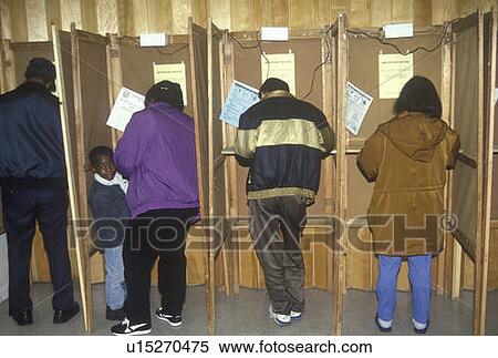 Voters and voting booths in a polling place View Large Photo Image Stock Photography - Voters and voting booths in a polling place. Fotosearch