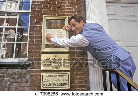 Stock Photograph - Waiter affixes menu at Gadsby's Tavern Museum in Old Town Alexandria, Alexandria, Washington, DC. Fotosearch