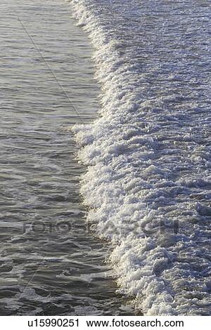 Wave Breaking at Sunrise View Large Photo Image Stock Image - Wave Breaking at Sunrise. Fotosearch