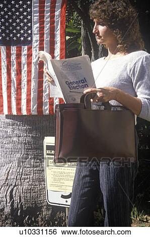 Woman voter reading election pamphlet View Large Photo Image Stock Photograph - Woman voter reading election pamphlet. Fotosearch