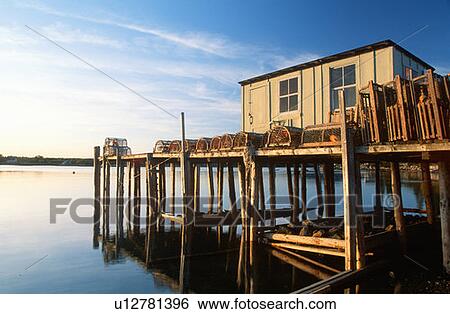 Wooden fishing pier with lobster traps View Large Photo Image Stock Photograph - Wooden fishing pier with lobster traps. Fotosearch