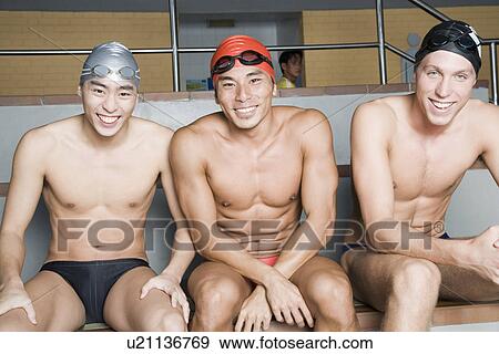 Portrait of three young men sitting together and smiling View Large Photo Image Stock Photo - Portrait of three young men sitting together and smiling. Fotosearch