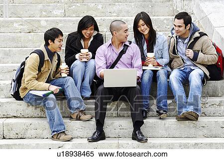 Five young college students sitting on steps and smiling View Large Photo Image Stock Photography - Five young college students sitting on steps and smiling. Fotosearch