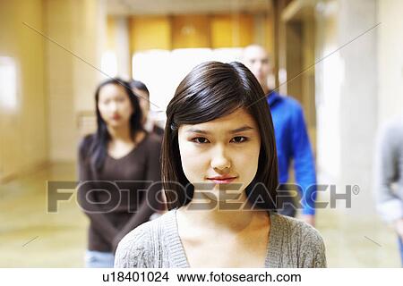 Portrait of a young woman walking in the corridor View Large Photo Image Picture - Portrait of a young woman walking in the corridor. Fotosearch