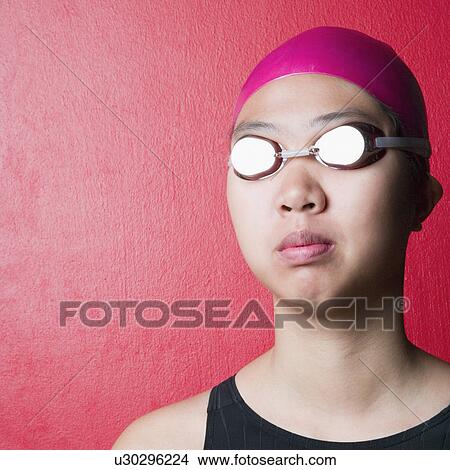 Close-up of a young woman wearing swimwear View Large Photo Image Picture - Close-up of a young woman wearing swimwear. Fotosearch