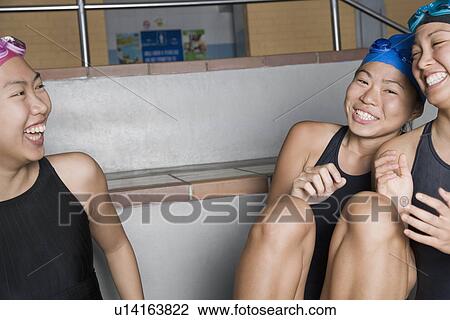 Close-up of three young women wearing swimwear and smiling View Large Photo Image Stock Image - Close-up of three young women wearing swimwear and smiling. Fotosearch
