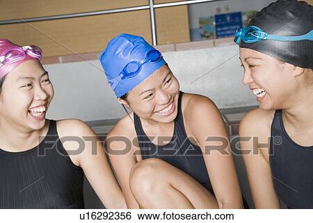 Close-up of three young women wearing swimwear and smiling View Large Photo Image Stock Photograph - Close-up of three young women wearing swimwear and smiling. Fotosearch