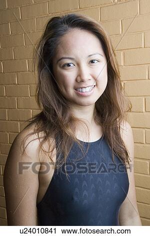 Portrait of a young woman smiling View Large Photo Image Stock Image - Portrait of a young woman smiling. Fotosearch