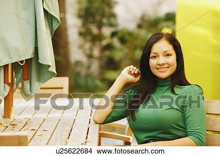 Portrait of a young woman smiling View Large Photo Image Picture - Portrait of a young woman smiling. Fotosearch